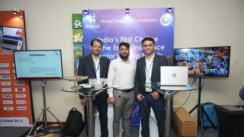 Exhibition stand on the floor of an Empiric Business Media event, with delegates in conversation