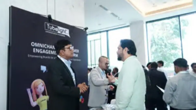 Exhibition stand on the floor of an Empiric Business Media event, with delegates in conversation