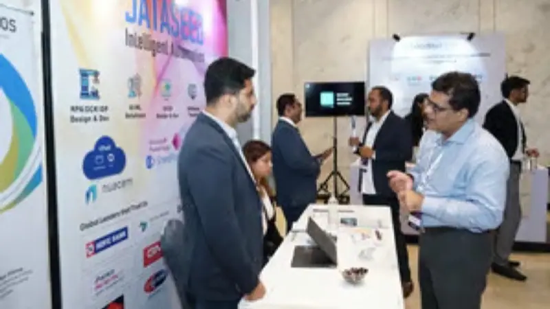 Exhibition stand on the floor of an Empiric Business Media event, with delegates in conversation