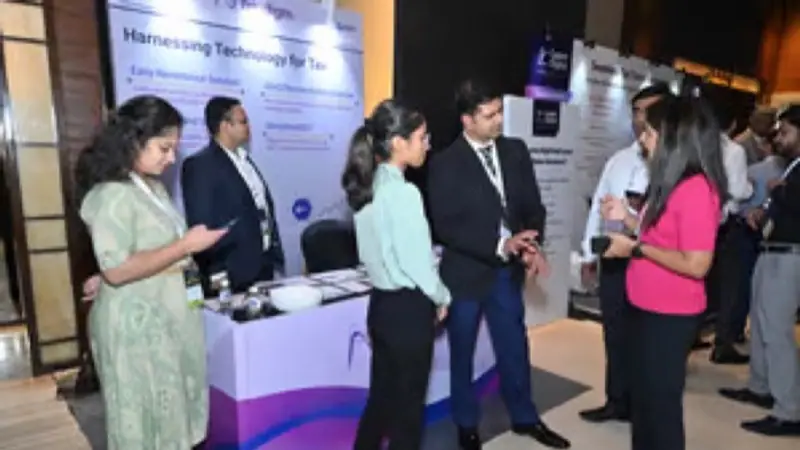 Exhibition stand on the floor of an Empiric Business Media event, with delegates in conversation