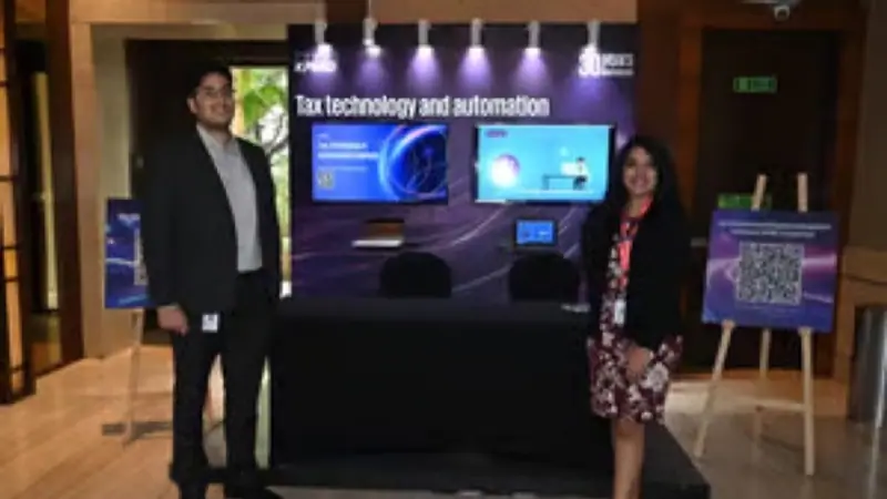 Exhibition stand on the floor of an Empiric Business Media event, with delegates in conversation