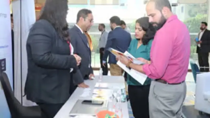 Exhibition stand on the floor of an Empiric Business Media event, with delegates in conversation