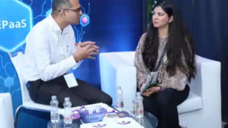 Exhibition stand on the floor of an Empiric Business Media event, with delegates in conversation