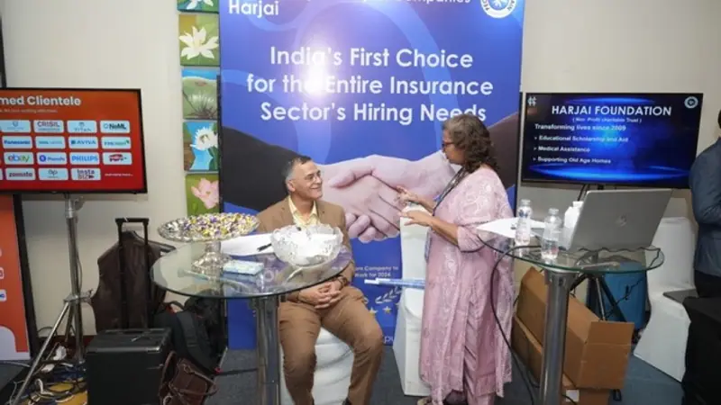 Exhibition stand on the floor of an Empiric Business Media event, with delegates in conversation